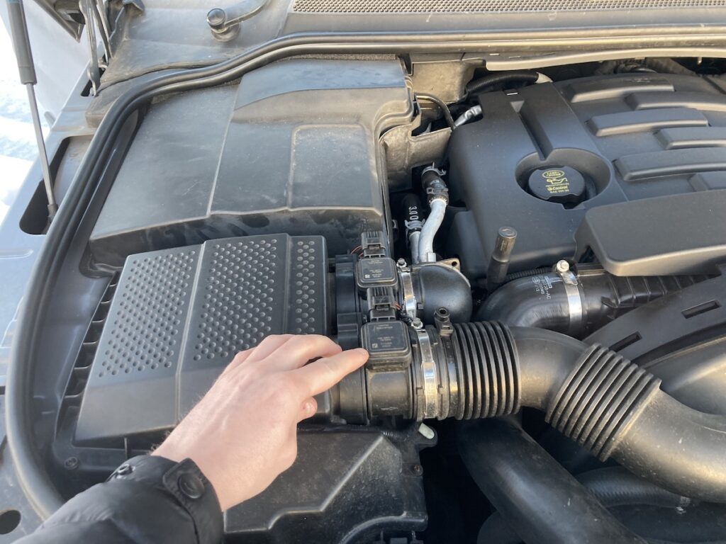 Where is the mass air flow sensor located?