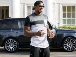 Anthony Joshua with his Range Rover in background.
